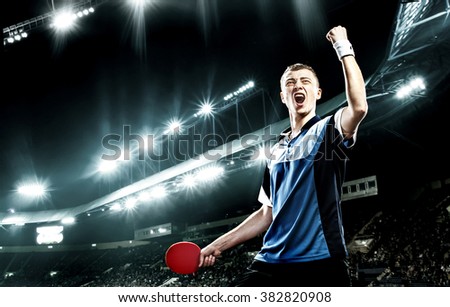 Young handsome sportsman celebrating flawless victory in table tennis