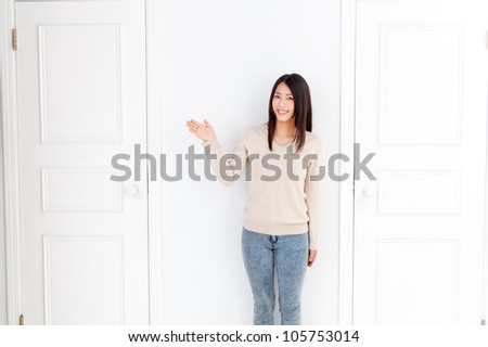 attractive asian woman with two doors
