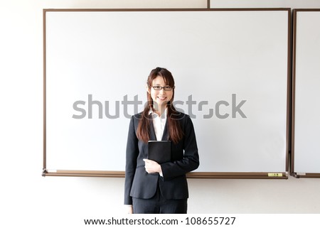 asian businesswoman and blank whiteboard