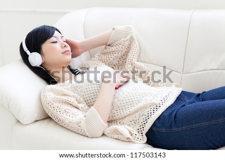 attractive asian woman sleeping on the sofa