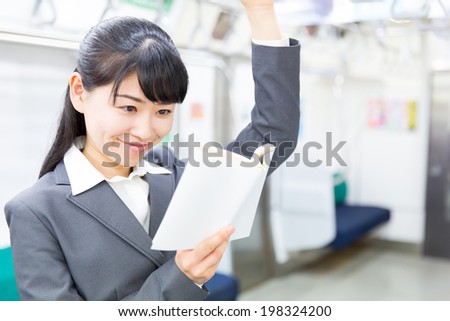 young asian businesswoman in the train
