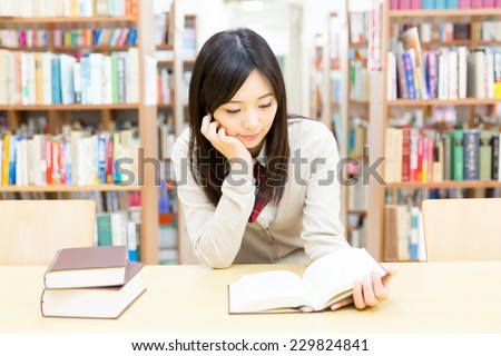 asian student studying in the library