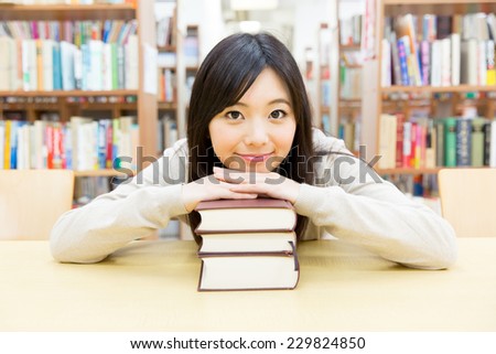 asian student studying in the library