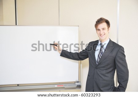 young business man explain at the whiteboard