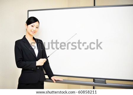 business woman explain at the whiteboard