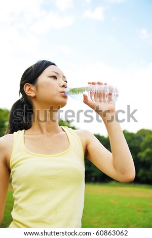 young asian woman drinking water