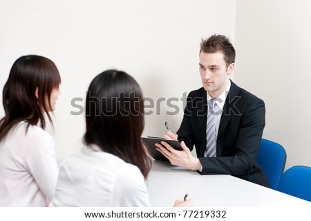 young teacher writing in the meeting room