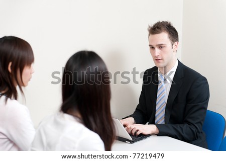 young teacher typing in the meeting room