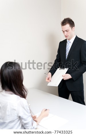 young teacher showing contract in the meeting room