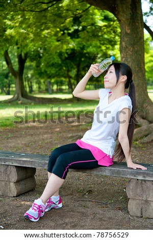 beautiful asian woman resting in the park