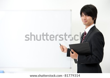 a businessman with blank whiteboard