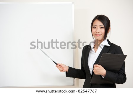 asian teacher with blank whiteboard