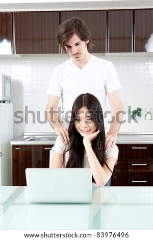 a young couple relaxing in the kitchen