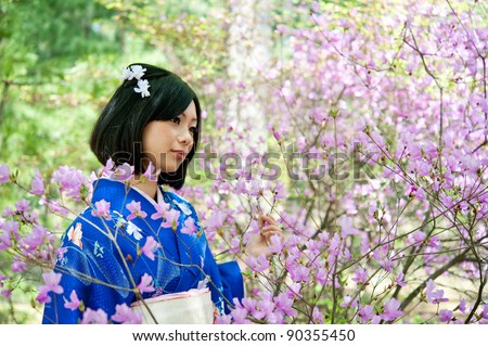 a portrait of japanese kimono woman with cherry blossom