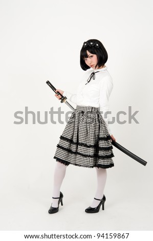 attractive fashionable asian woman with japanese samurai sword
