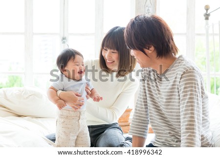 portrait of young asian family relaxing