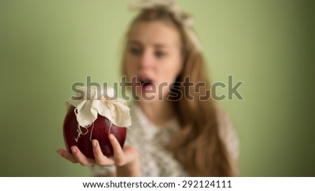 cute girl holding a favorite jam with strawberries