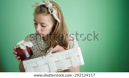 cute girl holding a favorite jam with strawberries