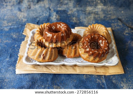 Composition of food, donuts on blue fabric background