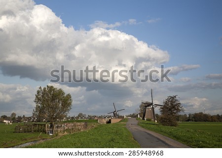 Dutch polder with windmills, village Streefkerk in background, South Holland, Netherlands