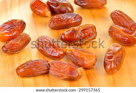 Date fruit isolated on wooden  background