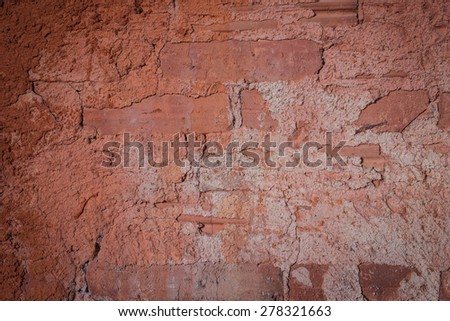 Brick walls are coated with earth orange.\Inside the brick kiln