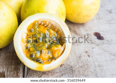 Passion fruits on wooden background