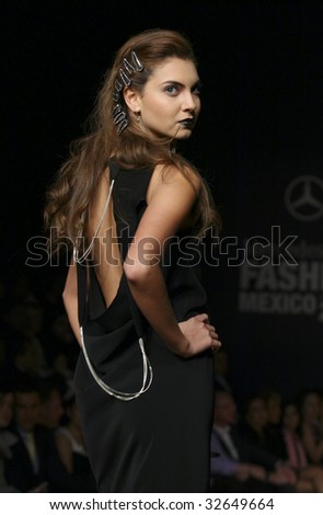 MEXICO CITY - MAY 20: A model walks the runway wearing Cesar Arellanes Autumn/Winter 2009 during Mercedes-Benz Fashion Mexico Autum/Winter 2009 May 20, 2009 in Mexico City.