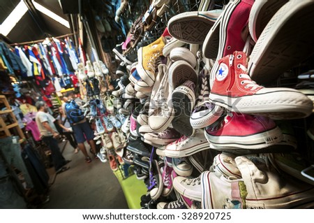 CHATUCHAK MARKET, BANGKOK - JUNE 13, 2015 - Old Converse trainers at Chatuchak Market, Bangkok. Chatuchak is said to be the largest market in the world, with over 8000 stalls operating every weekend.