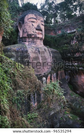 Portrait shot of the largest buddha statue in the world and a major tourist attraction in Leshan, Sichuan province, China