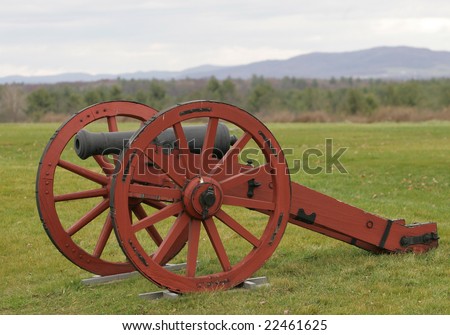 An American Revolutionary War cannon stands guard overlooking the battlefield.
