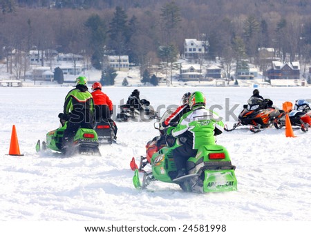 LAKE GEORGE, NY - February 7, 2009: A group of snowmobiles leaving after a fun filled day at the February 7 , 2009 Lake George Winter Carnival