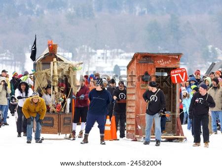 LAKE GEORGE, NY - February 7, 2009: Two teams line up for the start of an outhouse race on the ice at the February 7 , 2009 Lake George Winter Carnival.