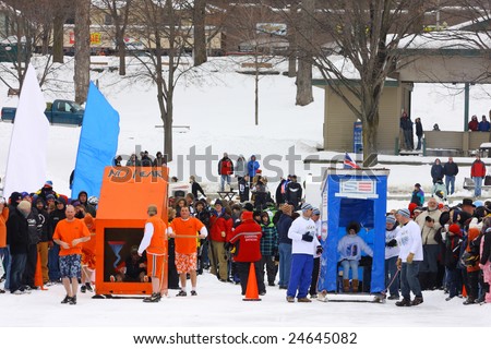 LAKE GEORGE, NY - February 7, 2009: Two teams line up for the start of an outhouse race on the ice at the February 7 , 2009 Lake George Winter Carnival.