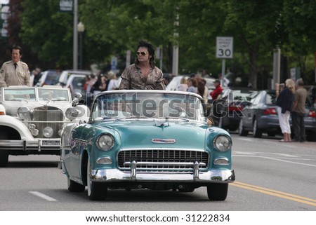 LAKE GEORGE, NY - MAY 30 : Elvis impersonators ride in the Elvis Classic Car Parade during the 2009 Lake George Elvis Festival May 30, 2009 in Lake George, NY.