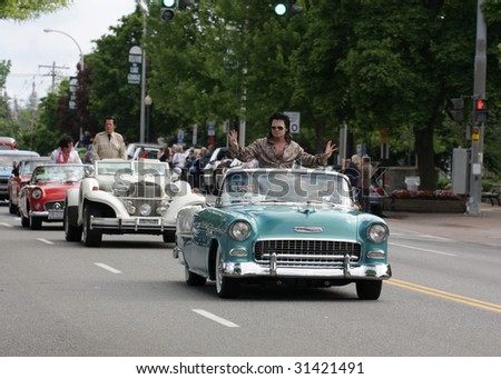 LAKE GEORGE, NY - MAY 30 : Elvis impersonators ride in the Elvis Classic Car Parade during the 2009 Lake George Elvis Festival May 30, 2009 in Lake George, NY.