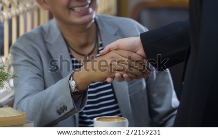 Welcome on board! Man shaking someone\'s hand and smiling
