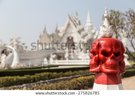 Skull statue in the White architectural of Wat Rong Khun, the famous Thai temple at Chiangrai province in Thailand.