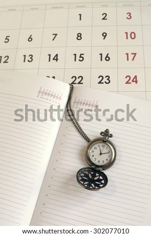Time concept: calendar, pocket watch and notebook