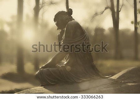 Girl statue in sun rays on blurry mystic foggy park background. Fountain Girl with a Broken Pitcher, Tsarskoye selo (Pushkin), St. Petersburg