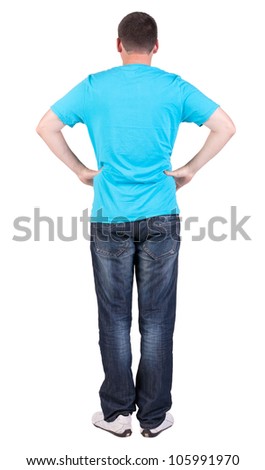Back view of young men in  blue t-shirt and jeans.  Guy  looks away. Rear view people collection.  backside view of person.  Isolated over white background.