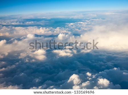 clouds. top view from the window of an airplane flying in the clouds. cloud spreading to the horizon