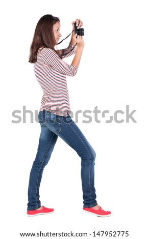 Back view of woman photographing.   girl photographer in jeans. Rear view people collection.  backside view of person.  Isolated over white background.