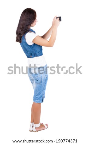 Back view of woman photographing.   girl photographer in shorts. Rear view people collection.  backside view of person.  Isolated over white background.
