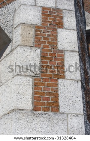 Stone and brick wall supporting the rampart for the train line that runs into the central station in Antwerp, Belgium