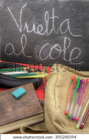 a vertical view of a back to school scene in Spanish