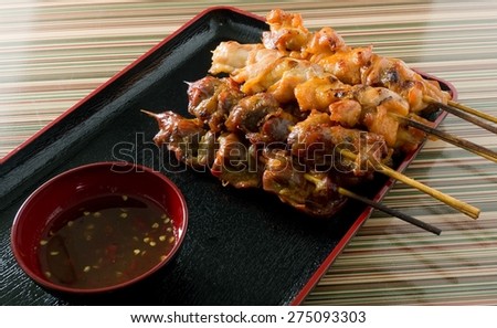 Food and Cuisine, Chicken Grilled or Barbecue Chicken on Bamboo Skewer Served with Spicy Sauce.