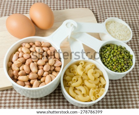 Food Ingredient, Raw Pasta, Rice, Peanuts, Mung Beans and Egg High in Carbohydrate and Protein.