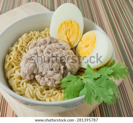 Cuisine and Food, Delicious Asian  Instant Noodles with Pork and Boiled Egg in A White Bowl.