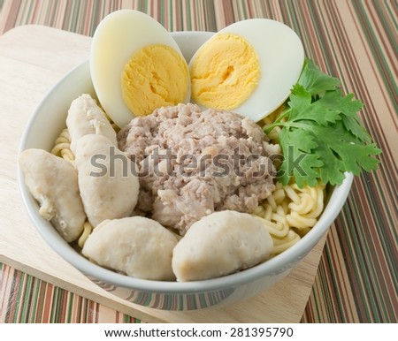 Cuisine and Food, Asian  Instant Noodles with Pork, Meat Ball and Boiled Egg in White Bowl.